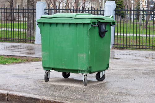 Business waste removal truck parked outside a commercial building in Hainault