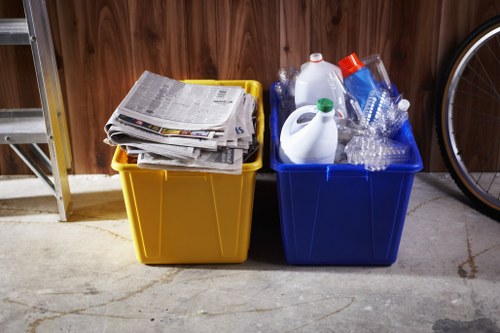 Separated bins for paper, glass, plastic and food waste in a commercial yard